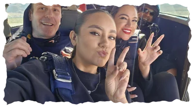 Group flashing peace signs inside flight cabin