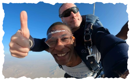 Happy skydiver giving thumbs up